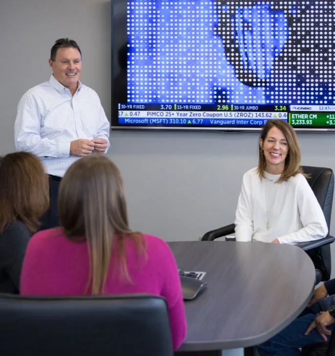 Members of staff at TI Fluid Systems having a meeting.